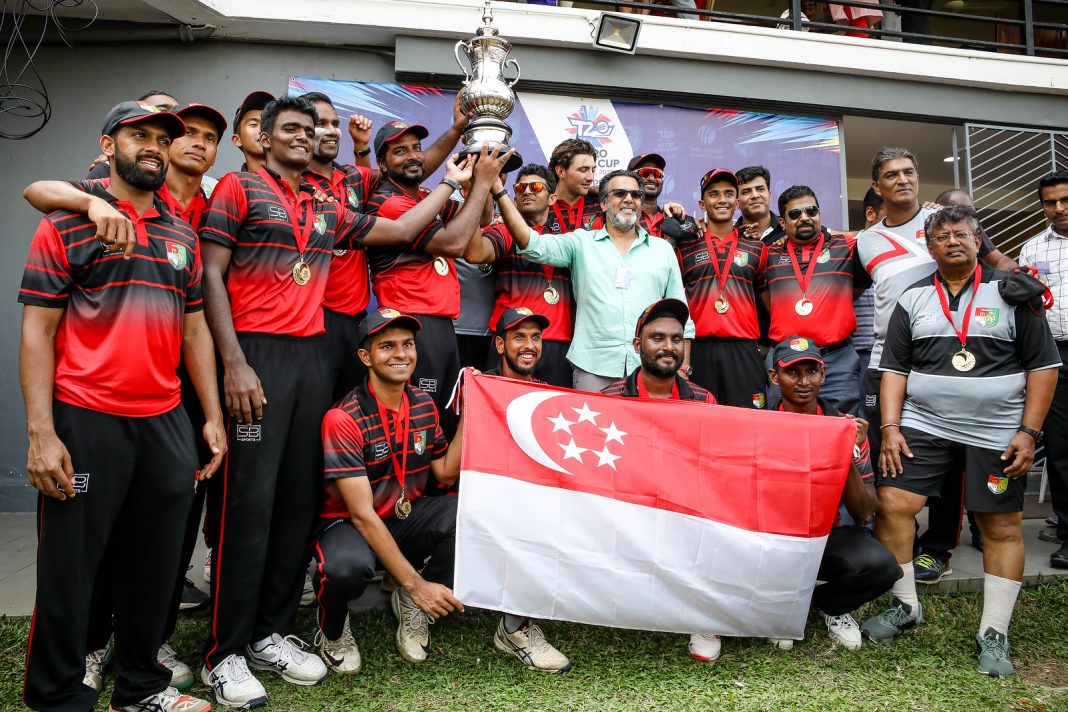Singapore holding the winners trophy after T20 World Cup Asia Final