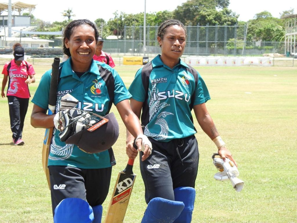 Walking off after her 105 not out, Tanya Ruma and Naoani Vare who made 14 not out (Photo: Cricket PNG)